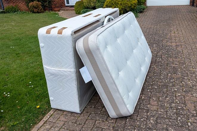 mattress being taken away for recycling